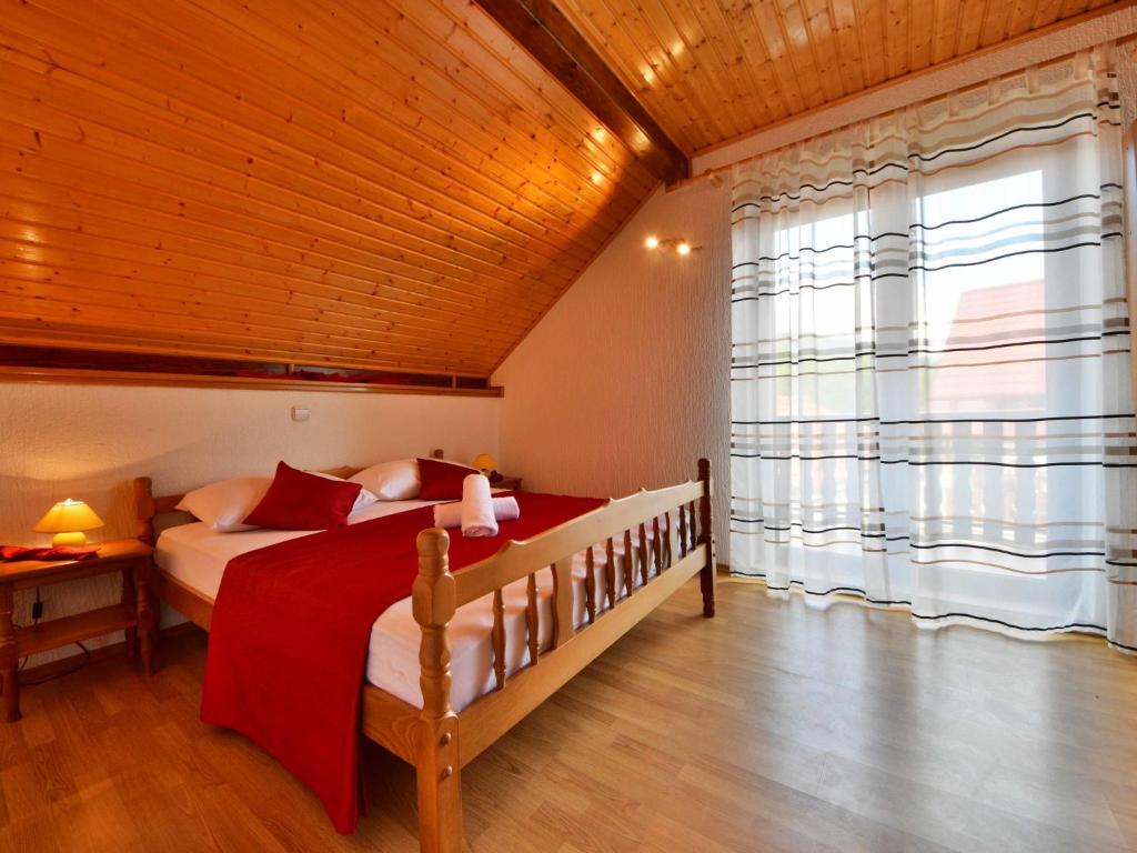 Postel nebo postele na pokoji v ubytování Holiday Home Nada by Interhome
