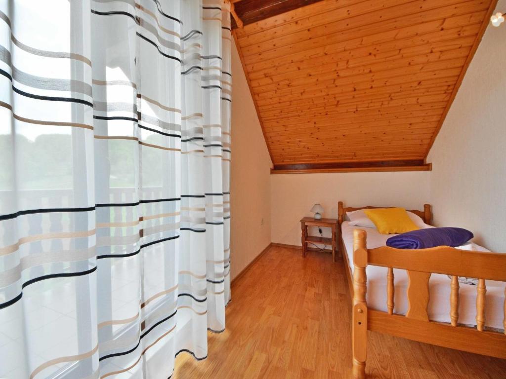 Postel nebo postele na pokoji v ubytování Holiday Home Nada by Interhome