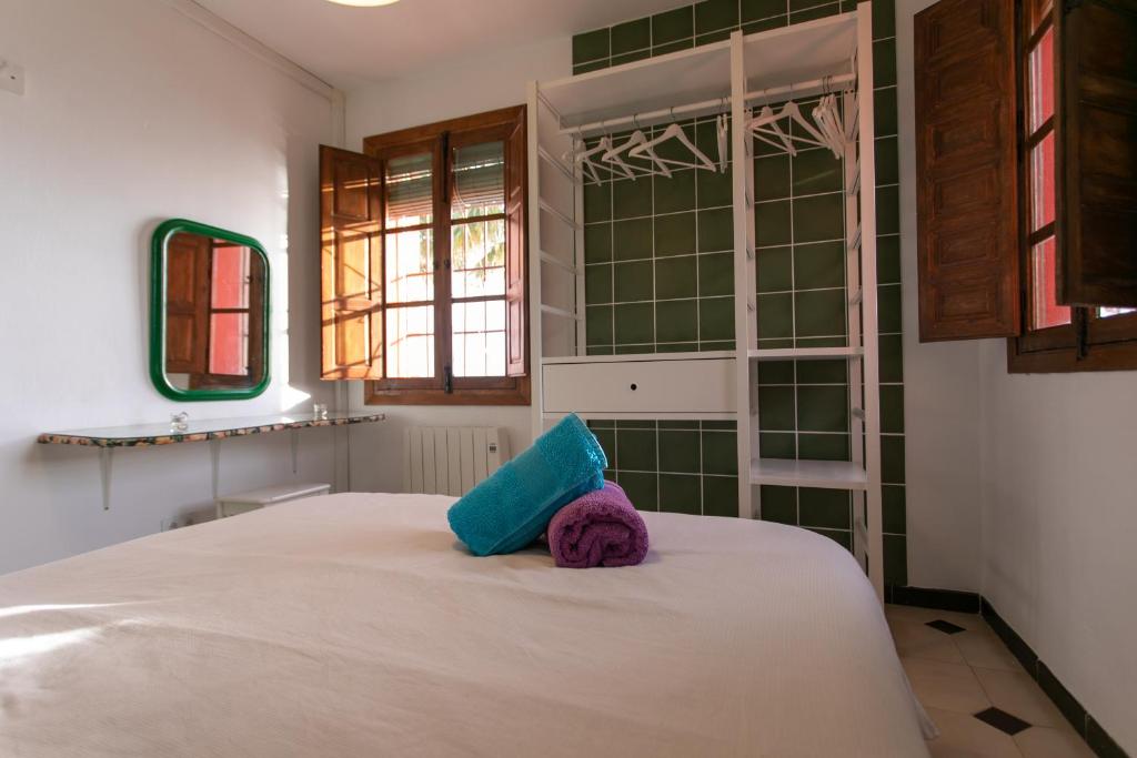 Postel nebo postele na pokoji v ubytování CASA CUARTEL EL VELERO