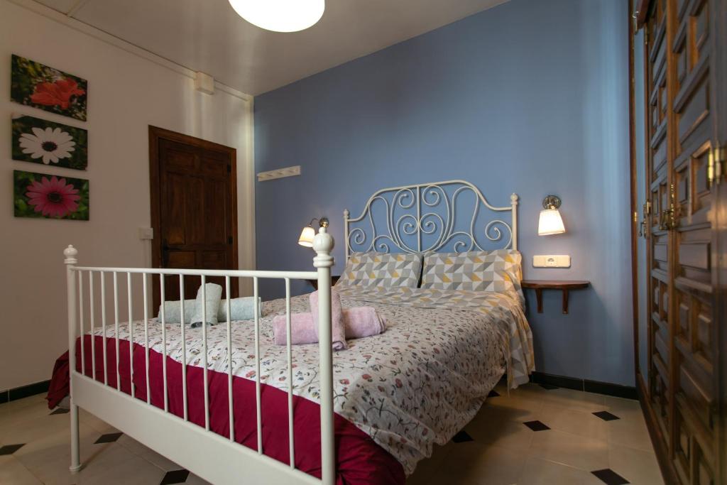 Postel nebo postele na pokoji v ubytování CASA CUARTEL EL VELERO