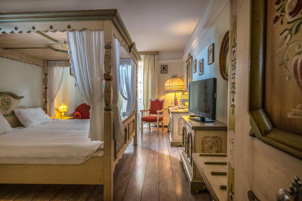 Postel nebo postele na pokoji v ubytování Corvin Hotel Budapest Sissi Wing