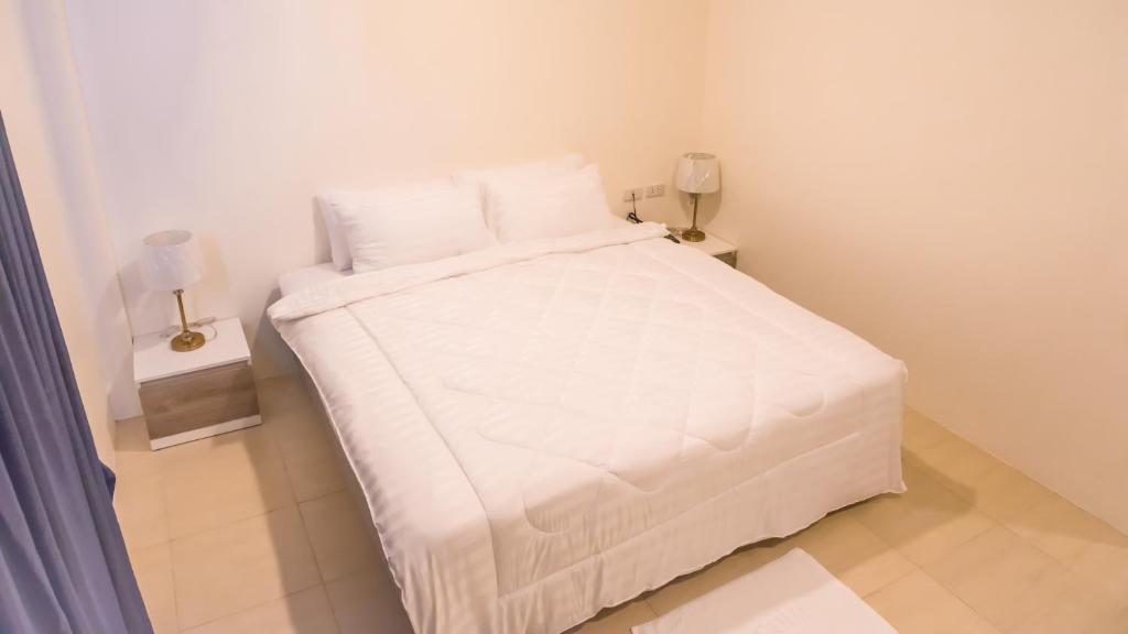 Postel nebo postele na pokoji v ubytování Mystays Phuket