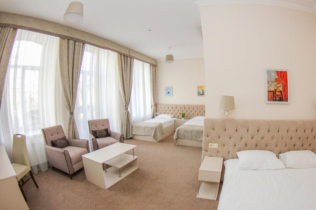 Postel nebo postele na pokoji v ubytování Hotel 52