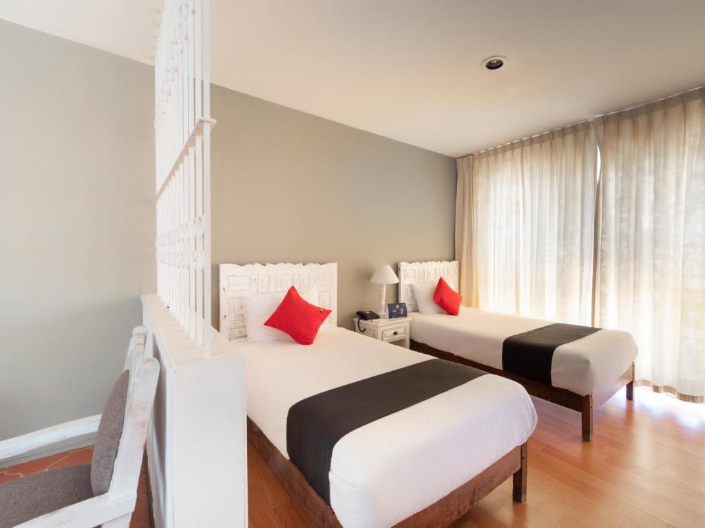 Postel nebo postele na pokoji v ubytování Suites Internacional