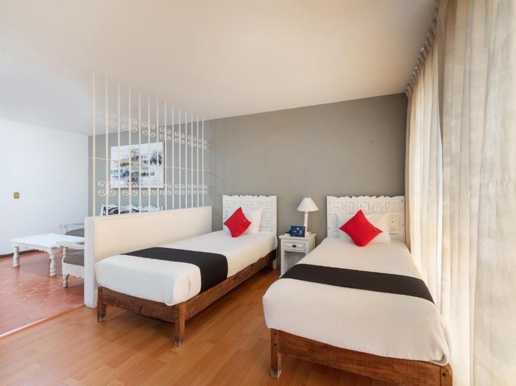 Postel nebo postele na pokoji v ubytování Suites Internacional