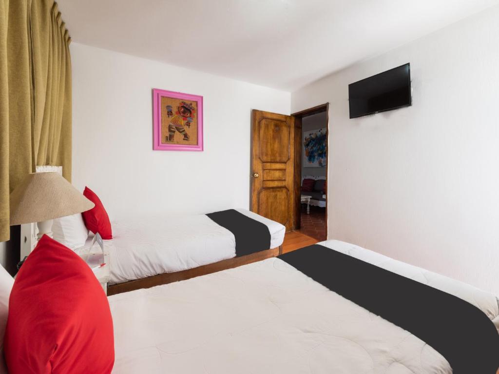 Postel nebo postele na pokoji v ubytování Suites Internacional