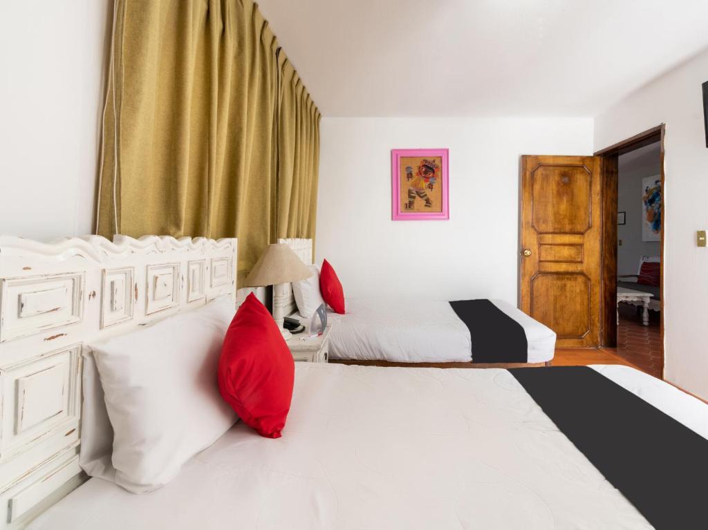 Postel nebo postele na pokoji v ubytování Suites Internacional