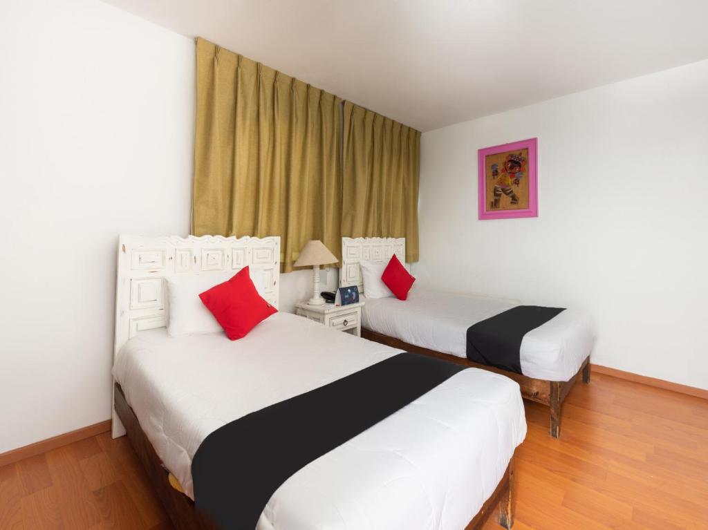 Postel nebo postele na pokoji v ubytování Suites Internacional