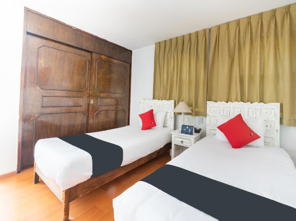 Postel nebo postele na pokoji v ubytování Suites Internacional