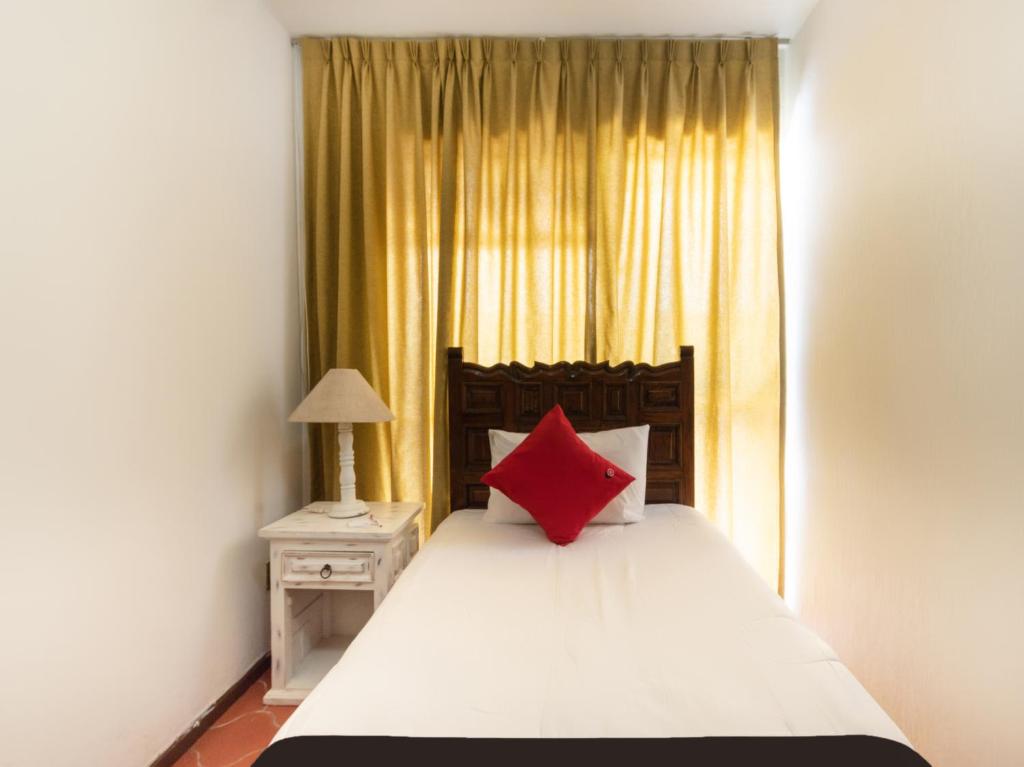 Postel nebo postele na pokoji v ubytování Suites Internacional