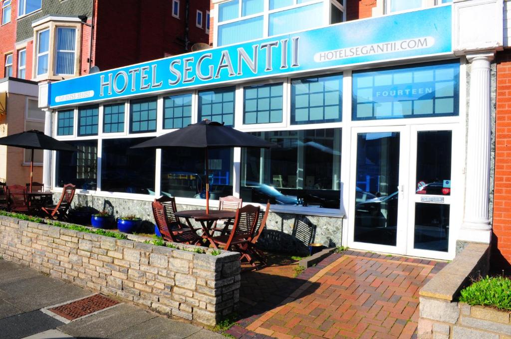 
a building with a sign on the front of it at Hotel Segantii in Blackpool
