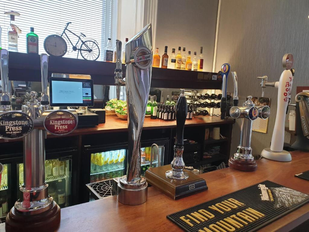 a bar with a trophy on top of a counter at Chase Hotel in Whitehaven