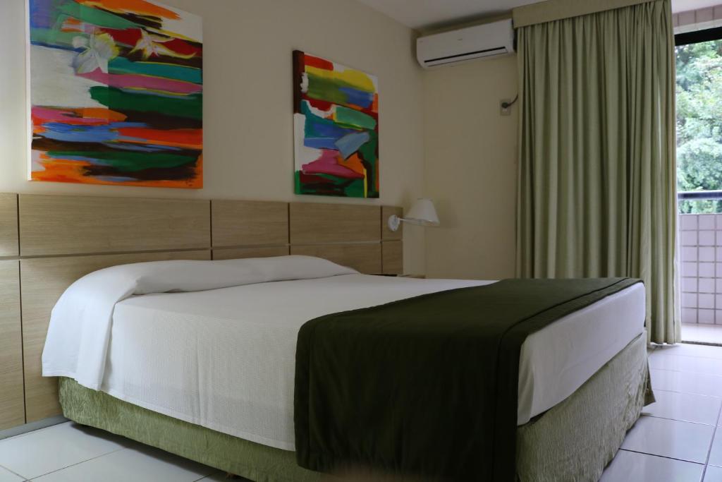 Postel nebo postele na pokoji v ubytování Praiabella Hotel