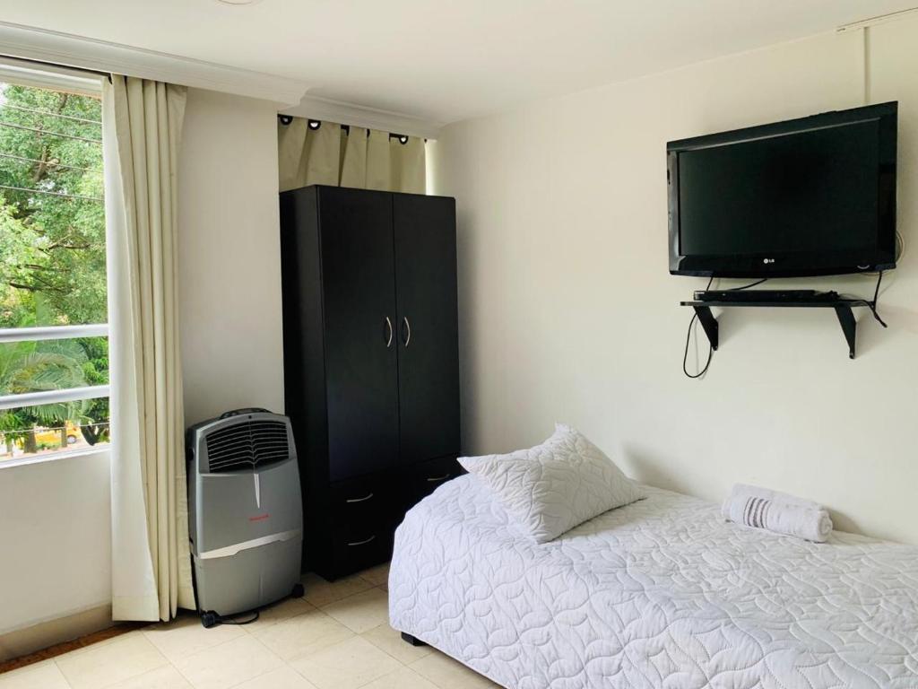 Postel nebo postele na pokoji v ubytování Hotel Lleras Premium #1