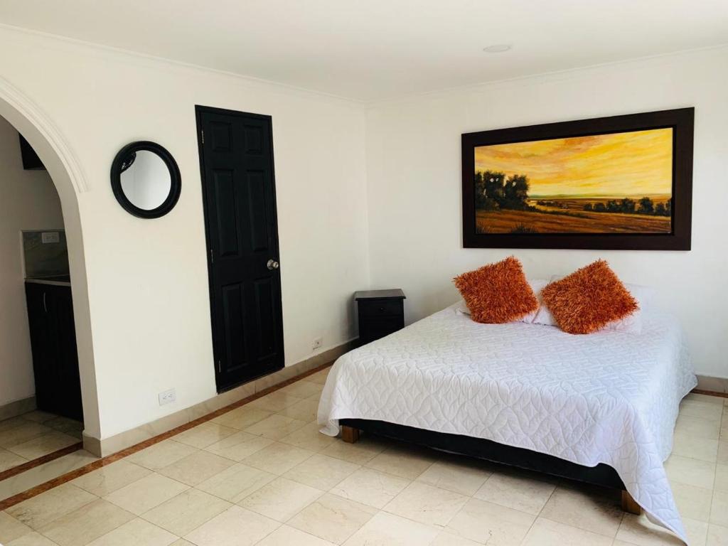 Postel nebo postele na pokoji v ubytování Hotel Lleras Premium #1