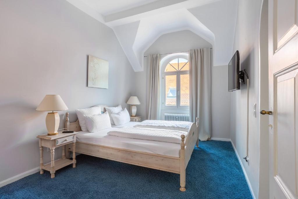 Postel nebo postele na pokoji v ubytování Hotel Annaberg