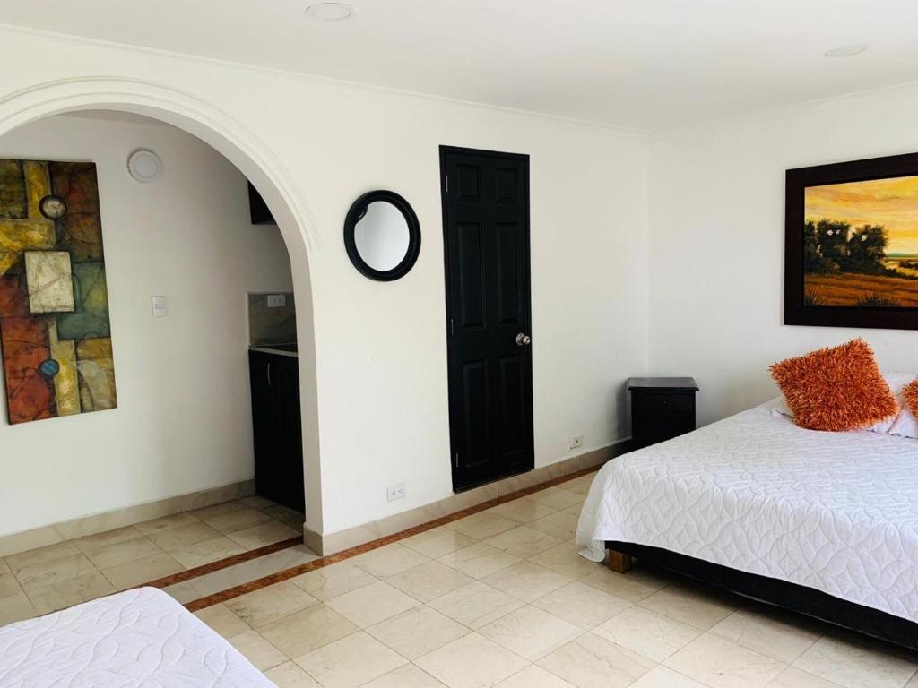 Postel nebo postele na pokoji v ubytování Hotel Lleras Premium #1