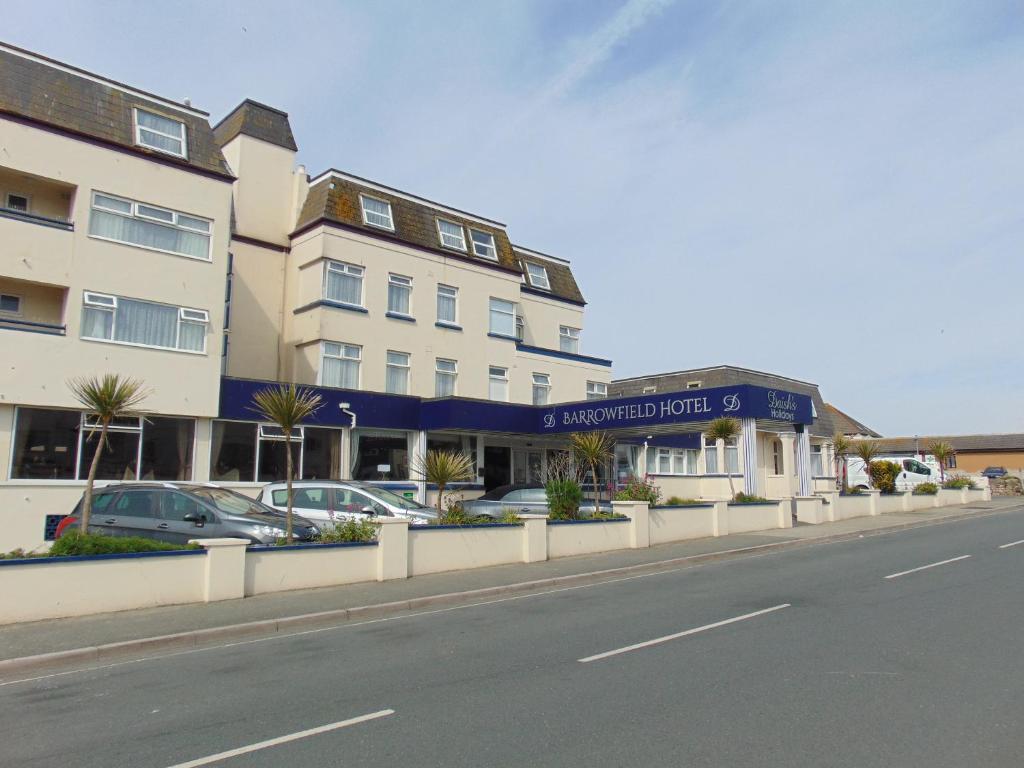 a building on a street with cars parked in front of it at Barrowfield Hotel in Newquay