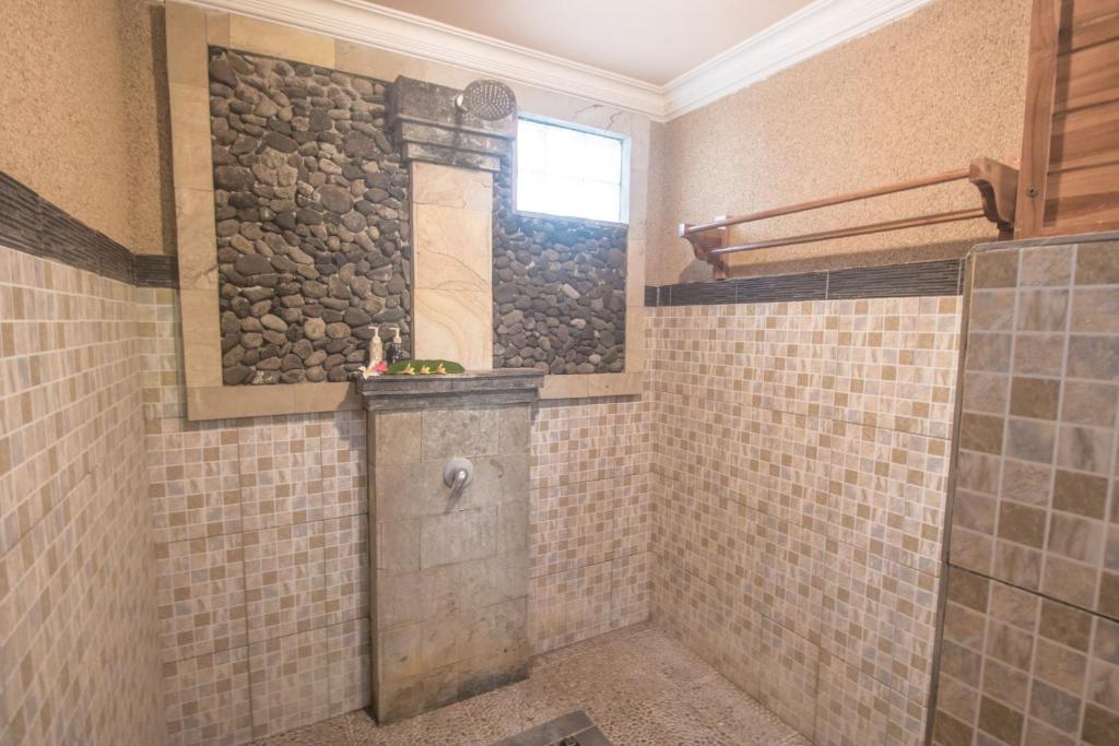 Koupelna v ubytování Trijaya Guest House Pemuteran