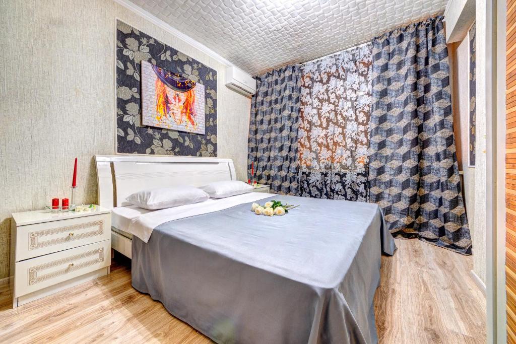 a bedroom with a bed and a table with fruit on it at Four-room apartment near the Opera of Ukraine in Kyiv