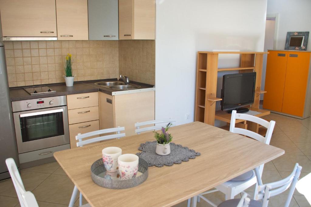 Kuchyň nebo kuchyňský kout v ubytování Apartment Olive Garden