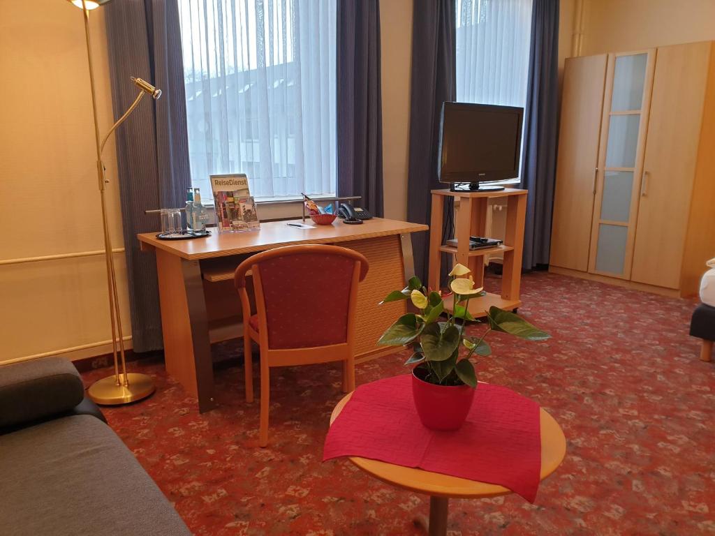 TV a/nebo společenská místnost v ubytování Avantgarde Hotel