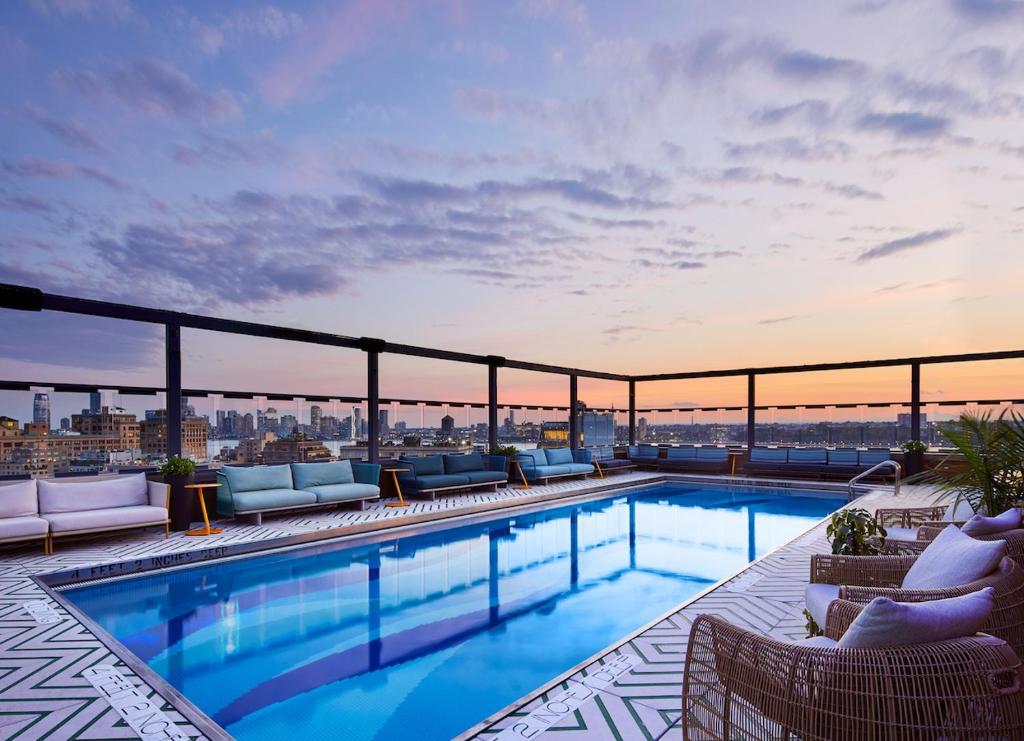 a swimming pool on the roof of a building at Gansevoort Meatpacking in New York