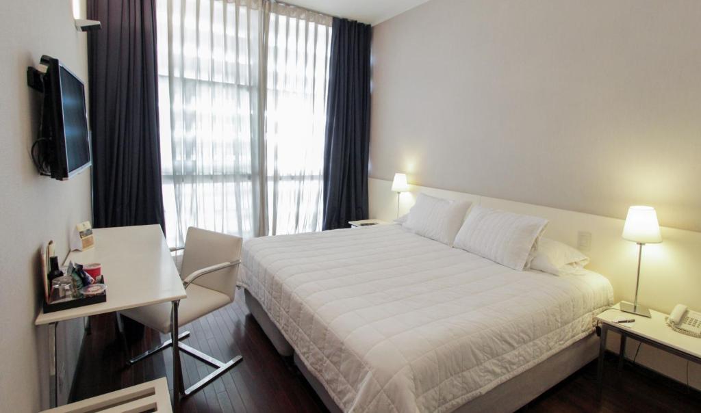 Postel nebo postele na pokoji v ubytování Hotel Guarani Asuncion
