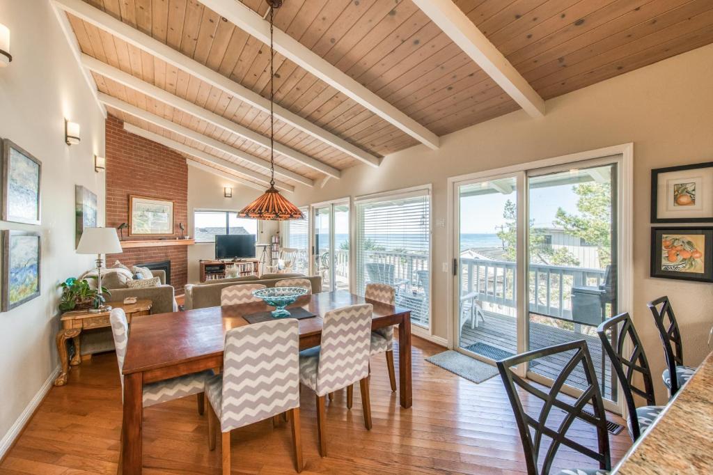 a dining room with a table and chairs at Awesome Views in Cambria