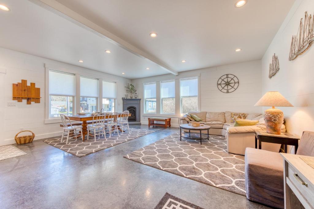 a living room with a couch and a table at Twin Rocks Beach Retreat in Rockaway Beach