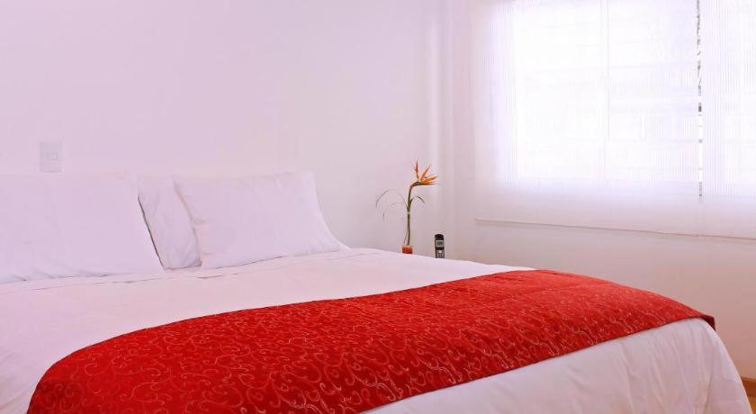 Postel nebo postele na pokoji v ubytování Hotel TuKasa Inn