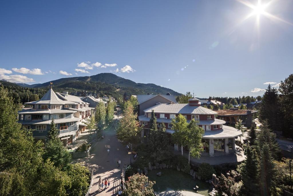 an aerial view of a resort with mountains in the background at Whistler Town Plaza by Latour Hotels and Resorts in Whistler