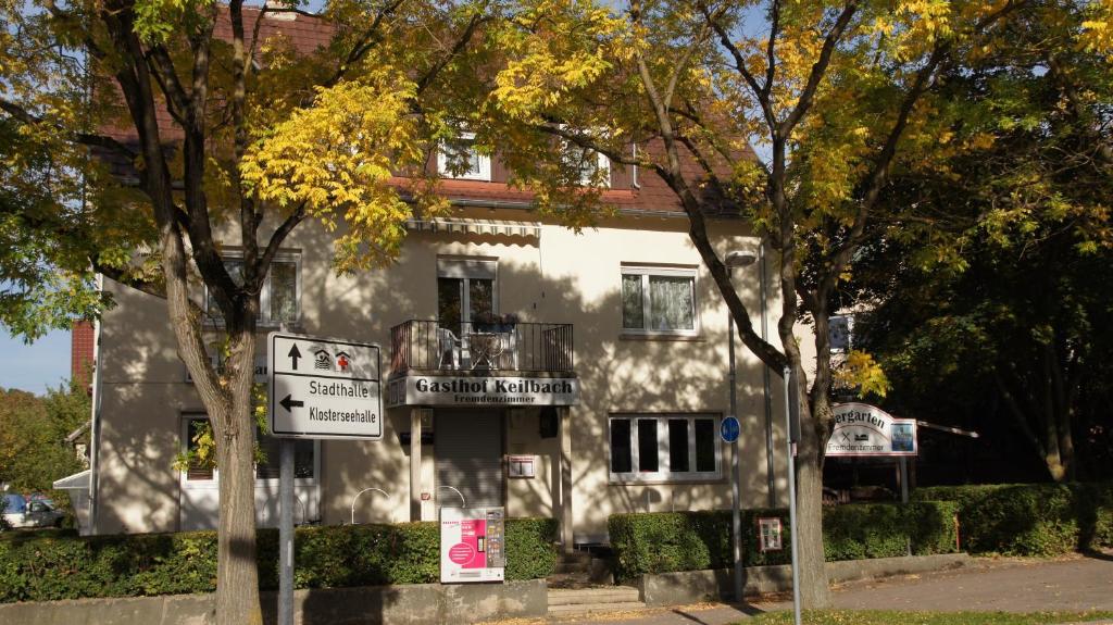 a white building with a sign in front of it at Gasthof Keilbach in Sindelfingen