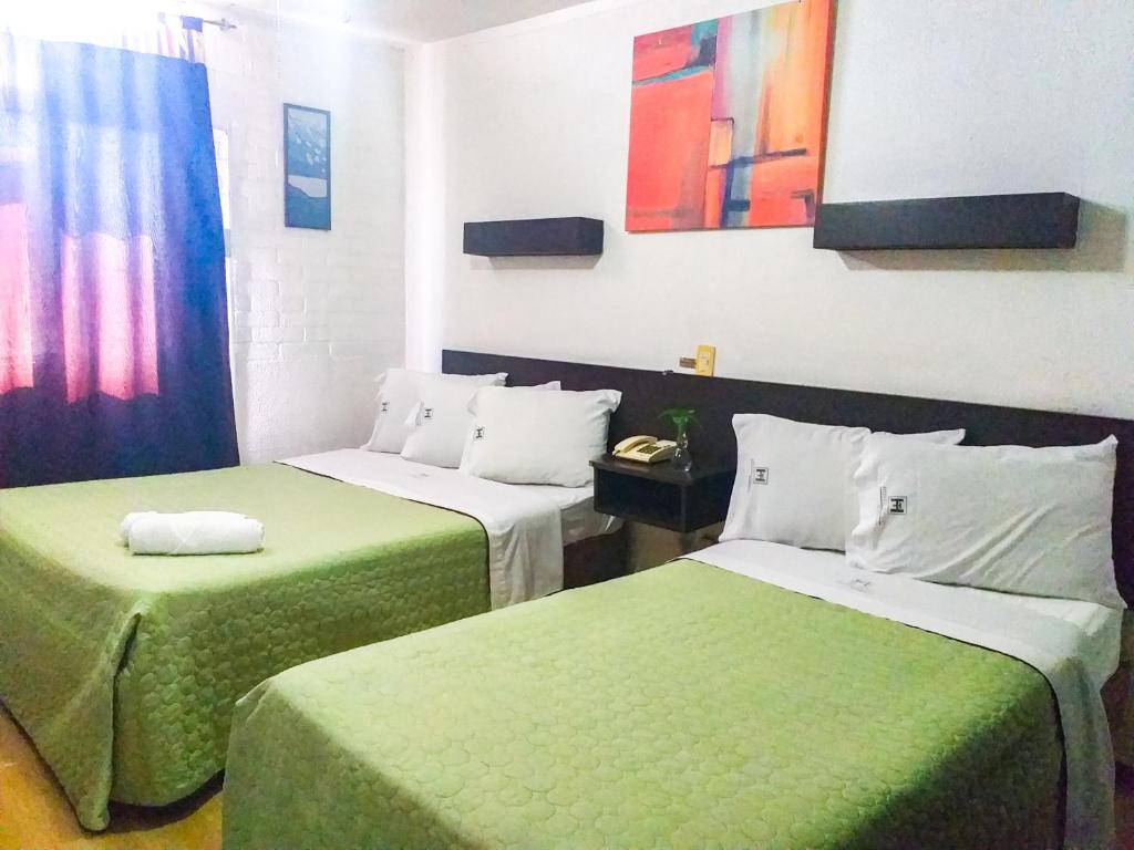 Postel nebo postele na pokoji v ubytování Hotel Trevi