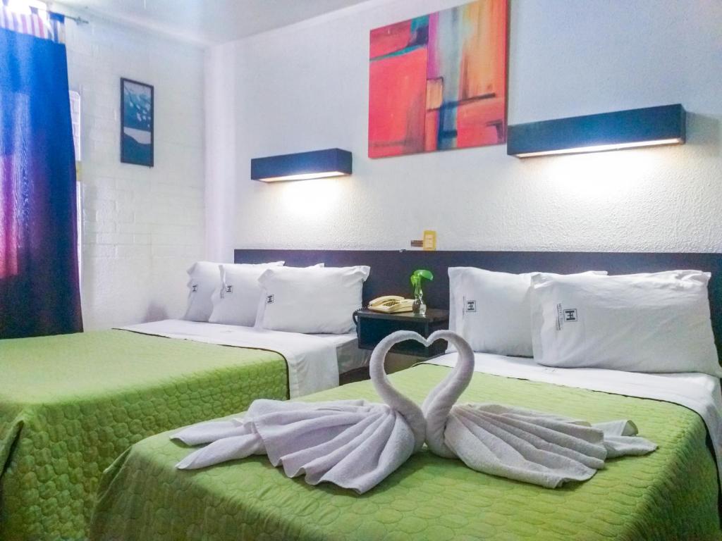 Кровать или кровати в номере Hotel Trevi