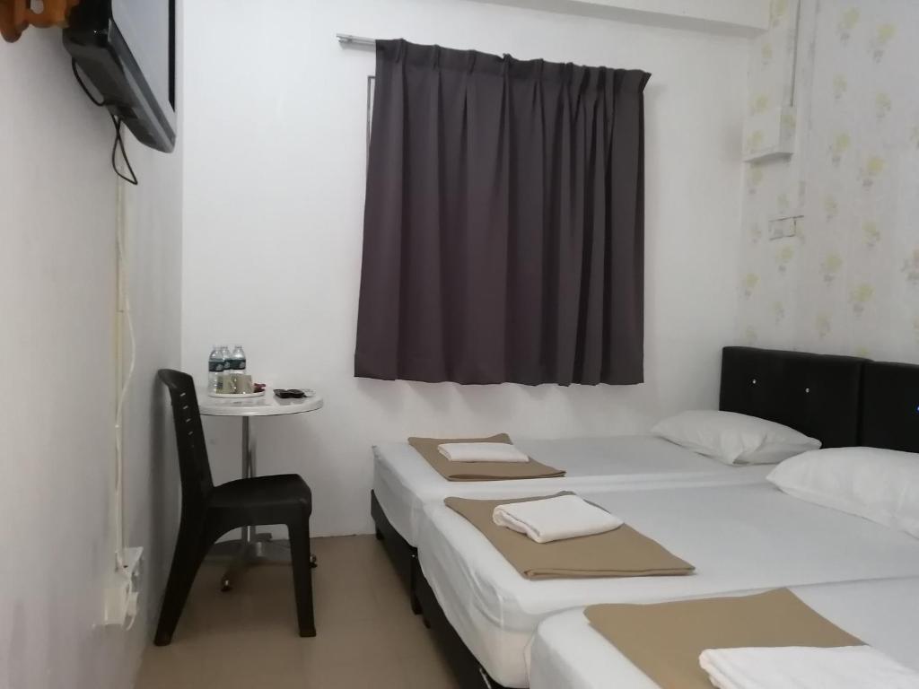 Postel nebo postele na pokoji v ubytování Rasa Motel