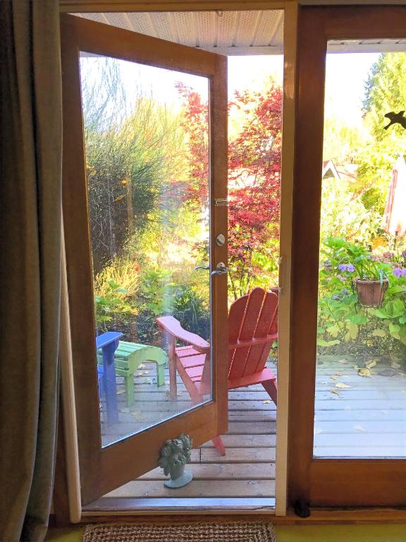 a door to a porch with a view of a patio at Wisteria Guest House in Ganges