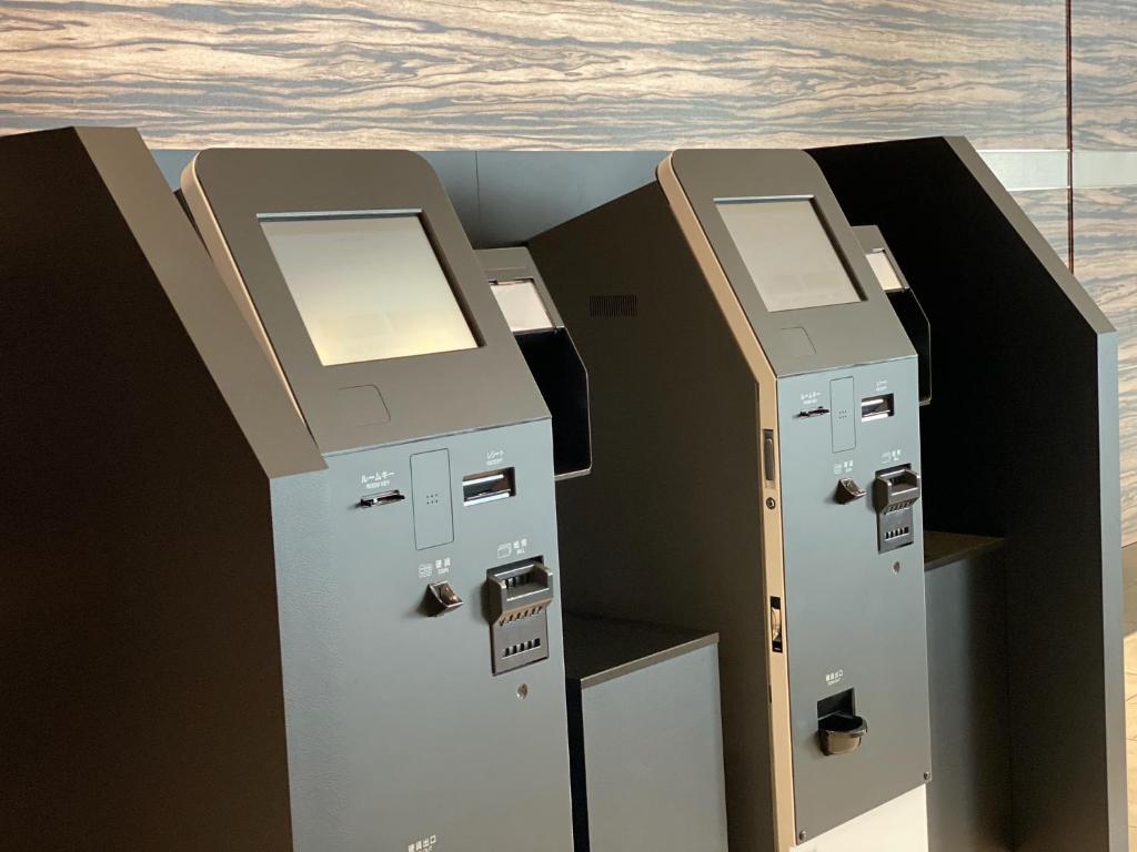 a row of lockers sitting next to each other at Hotel Trusty Osaka Abeno in Osaka