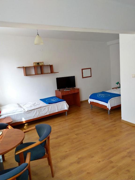Postel nebo postele na pokoji v ubytování OW Posejdon Jastarnia - blisko morza i nad zatoką