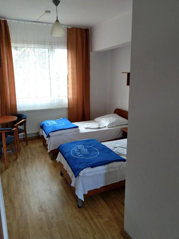 Postel nebo postele na pokoji v ubytování OW Posejdon Jastarnia - blisko morza i nad zatoką