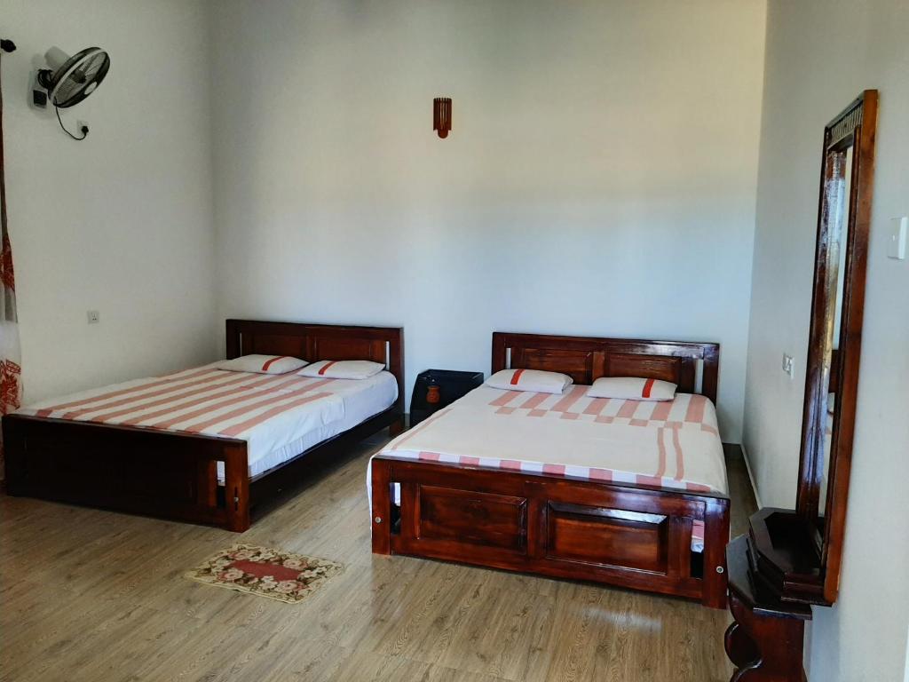 Postel nebo postele na pokoji v ubytování Lavender Home Yala Safari