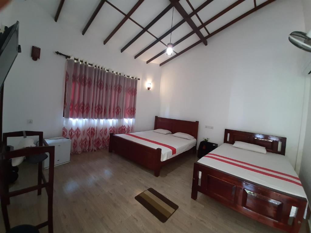 Postel nebo postele na pokoji v ubytování Lavender Home Yala Safari