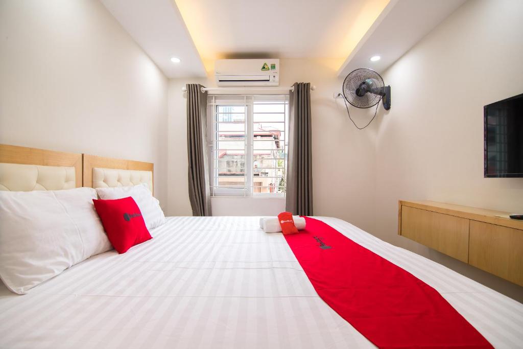 Postel nebo postele na pokoji v ubytování Newstyle Apartment Tran Duy Hung