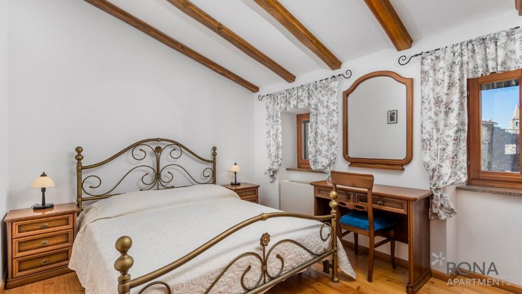 Postel nebo postele na pokoji v ubytování Rona stone house apartments Janja