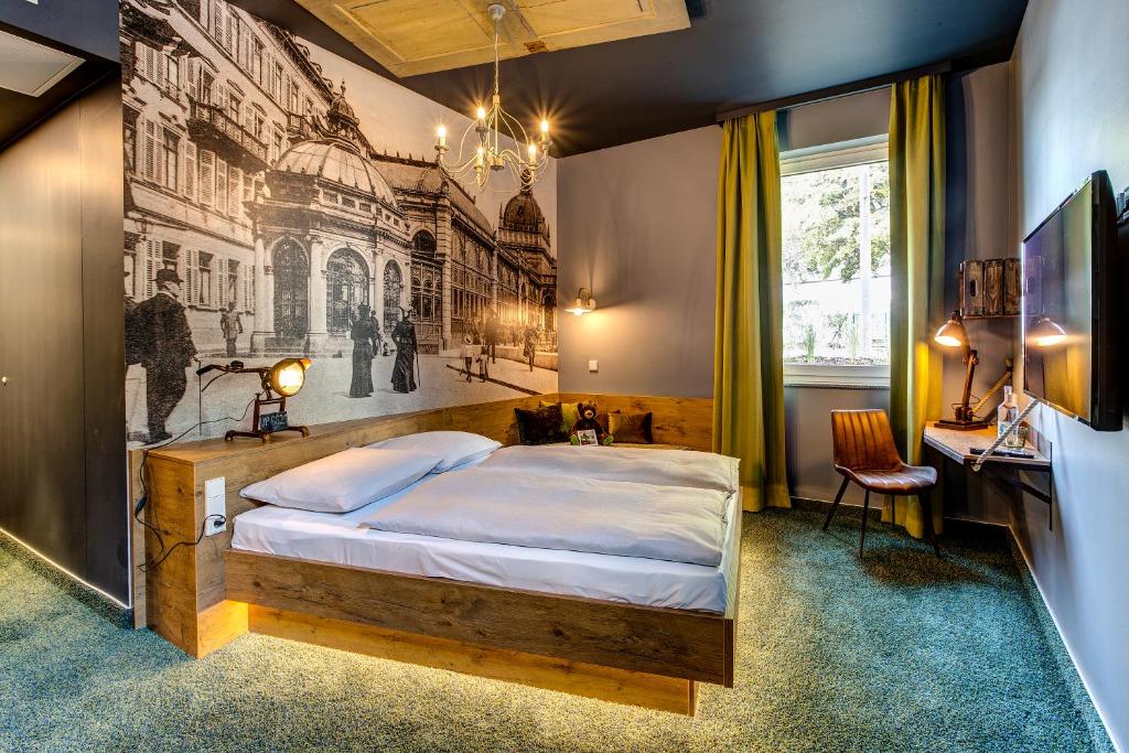 Postel nebo postele na pokoji v ubytování tinyTwice Hotel Wiesbaden