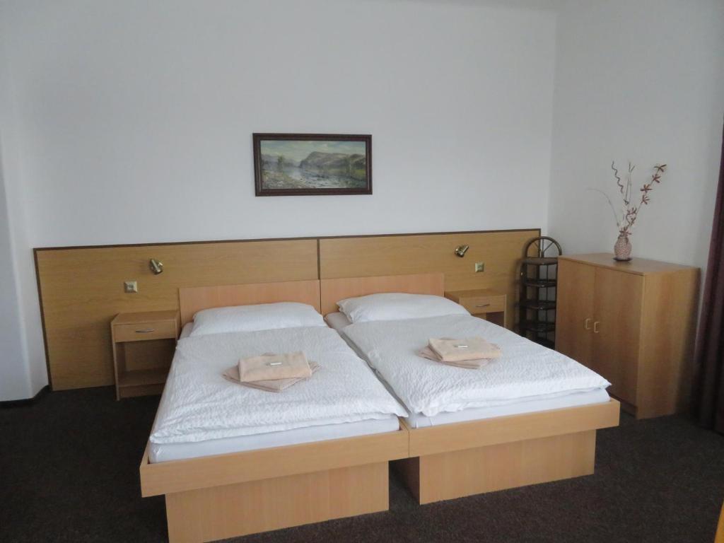 Postel nebo postele na pokoji v ubytování Hotel Lux
