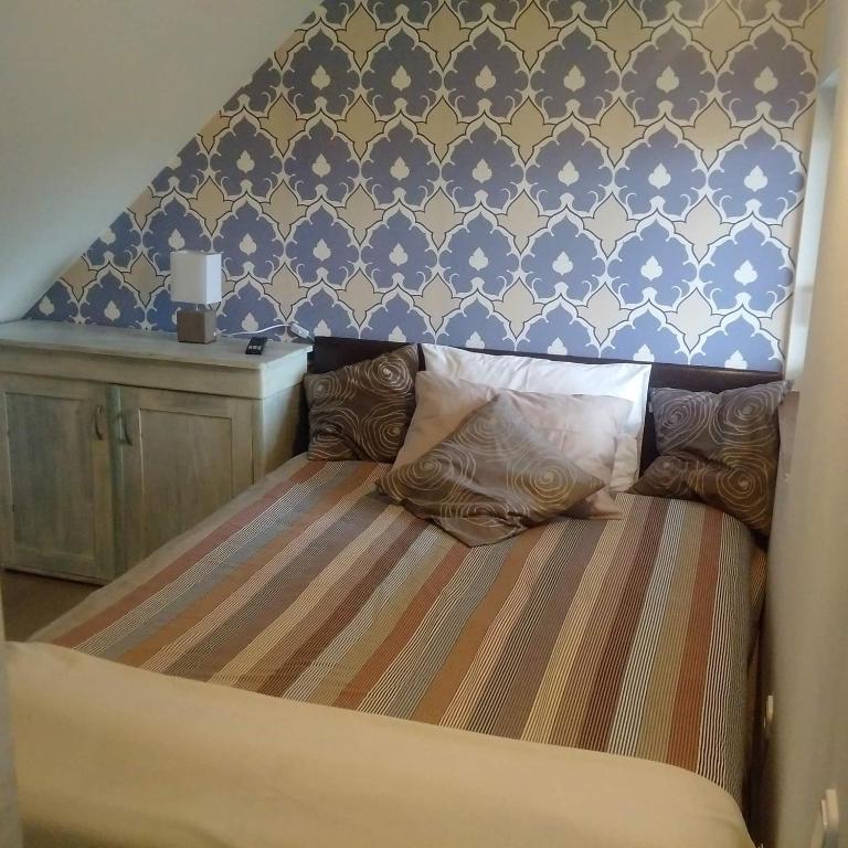 Posteľ alebo postele v izbe v ubytovaní Bástya apartman