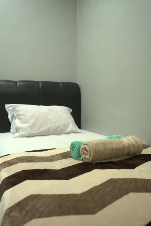 Postel nebo postele na pokoji v ubytování Argya Guesthouse