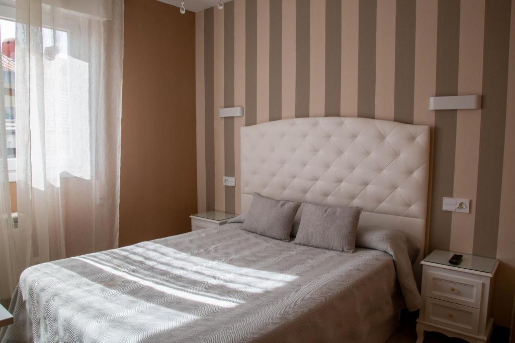 Postel nebo postele na pokoji v ubytování Alojamientos Rooms Catamarán