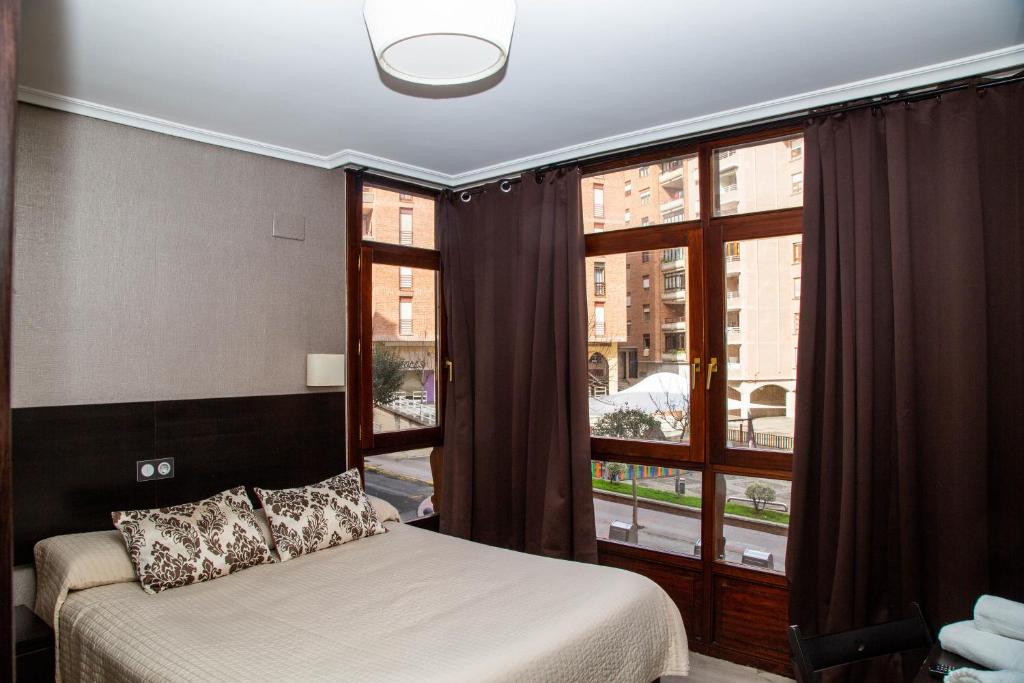 Postel nebo postele na pokoji v ubytování Alojamientos Rooms Catamarán
